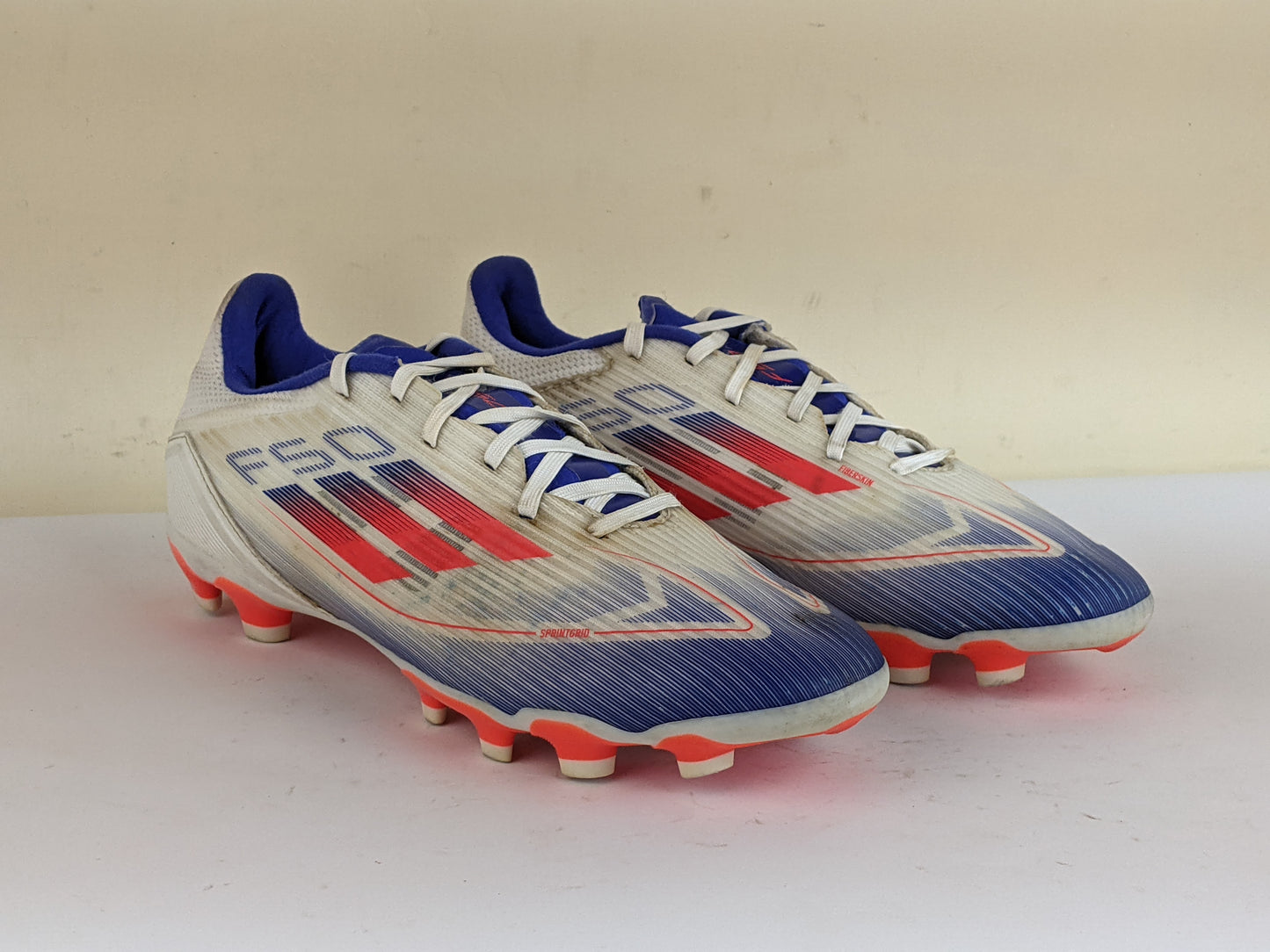 adidas F50 League MG Advancement - Footwear White/Solar Red/Lucid Blue