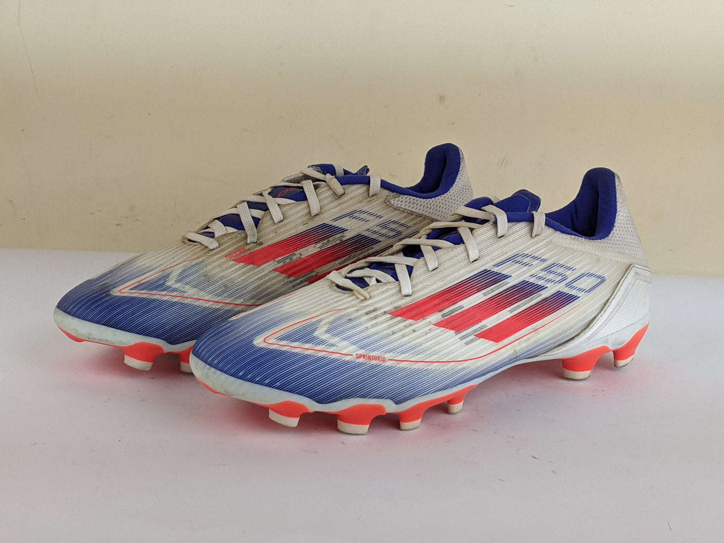 adidas F50 League MG Advancement - Footwear White/Solar Red/Lucid Blue