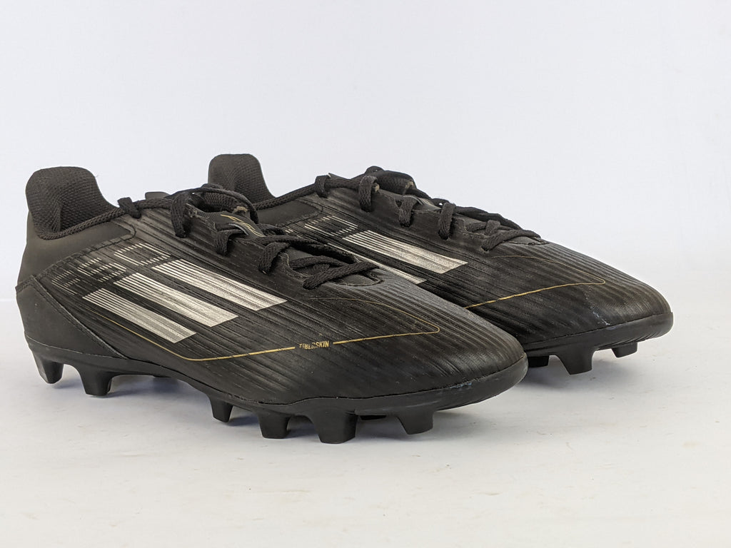 adidas F50 Club FxG Dark Spark - Core Black/Iron Metal/Gold Metallic