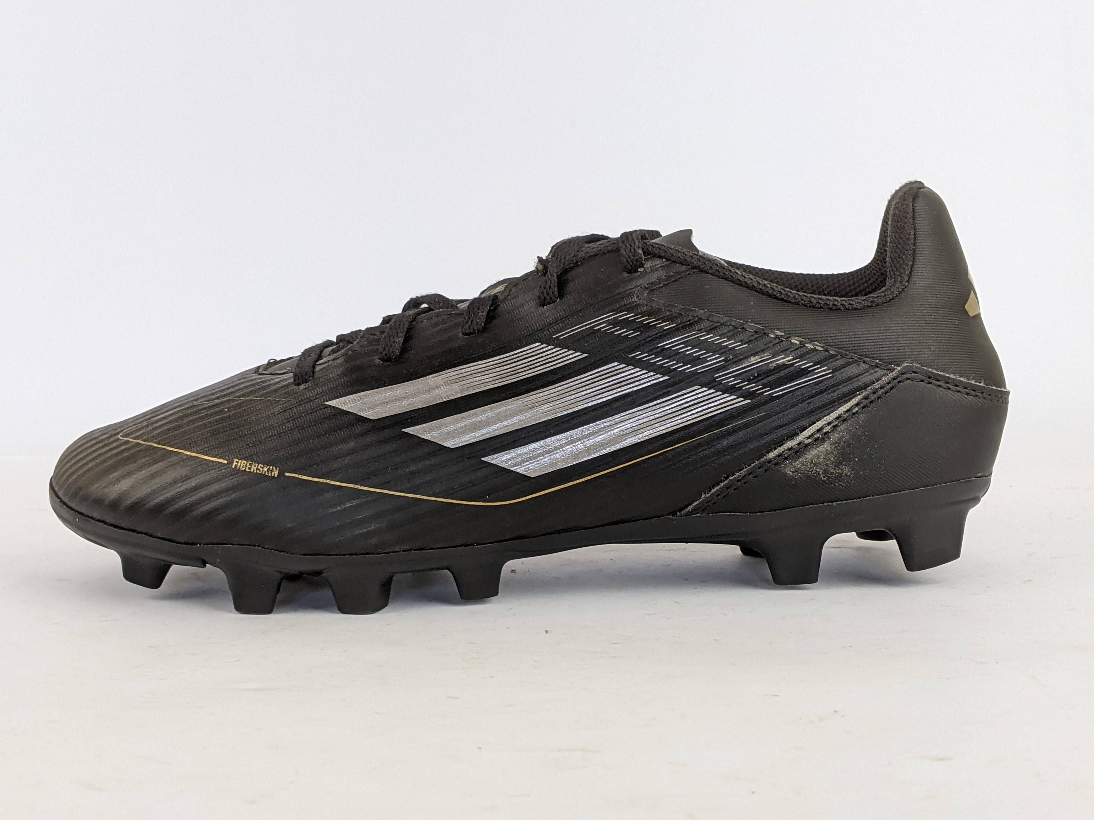 adidas F50 Club FxG Dark Spark - Core Black/Iron Metal/Gold Metallic