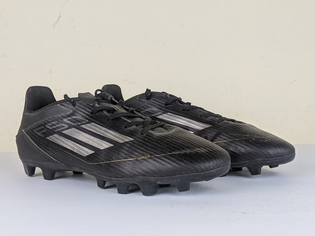 adidas F50 Club FxG Dark Spark - Core Black/Iron Metal/Gold Metallic
